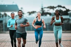 Sculpting Sleek Arms: The Essential Role of Cardio in Toning Without Bulking Up 3 image of people running to incorporate cardio Bracknell exercise into their life to help tone arms and body.