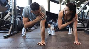 Image of man and woman doing Cardio Bracknell 	 to tone their arms. 